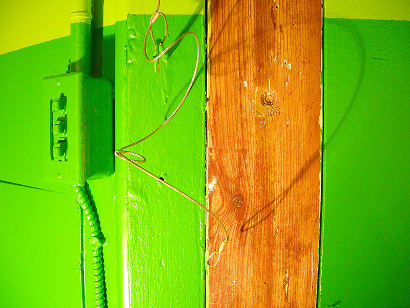Green wall image from SET THE CONTROLS FOR THE HEART OF THE SUN, installation at WRKS DVSN, by Kennedy Telford, 2006.