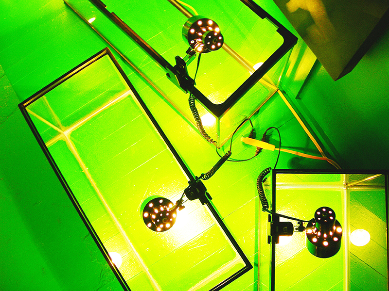 Lit fishtanks image from SET THE CONTROLS FOR THE HEART OF THE SUN, installation at WRKS DVSN, by Kennedy Telford, 2006.